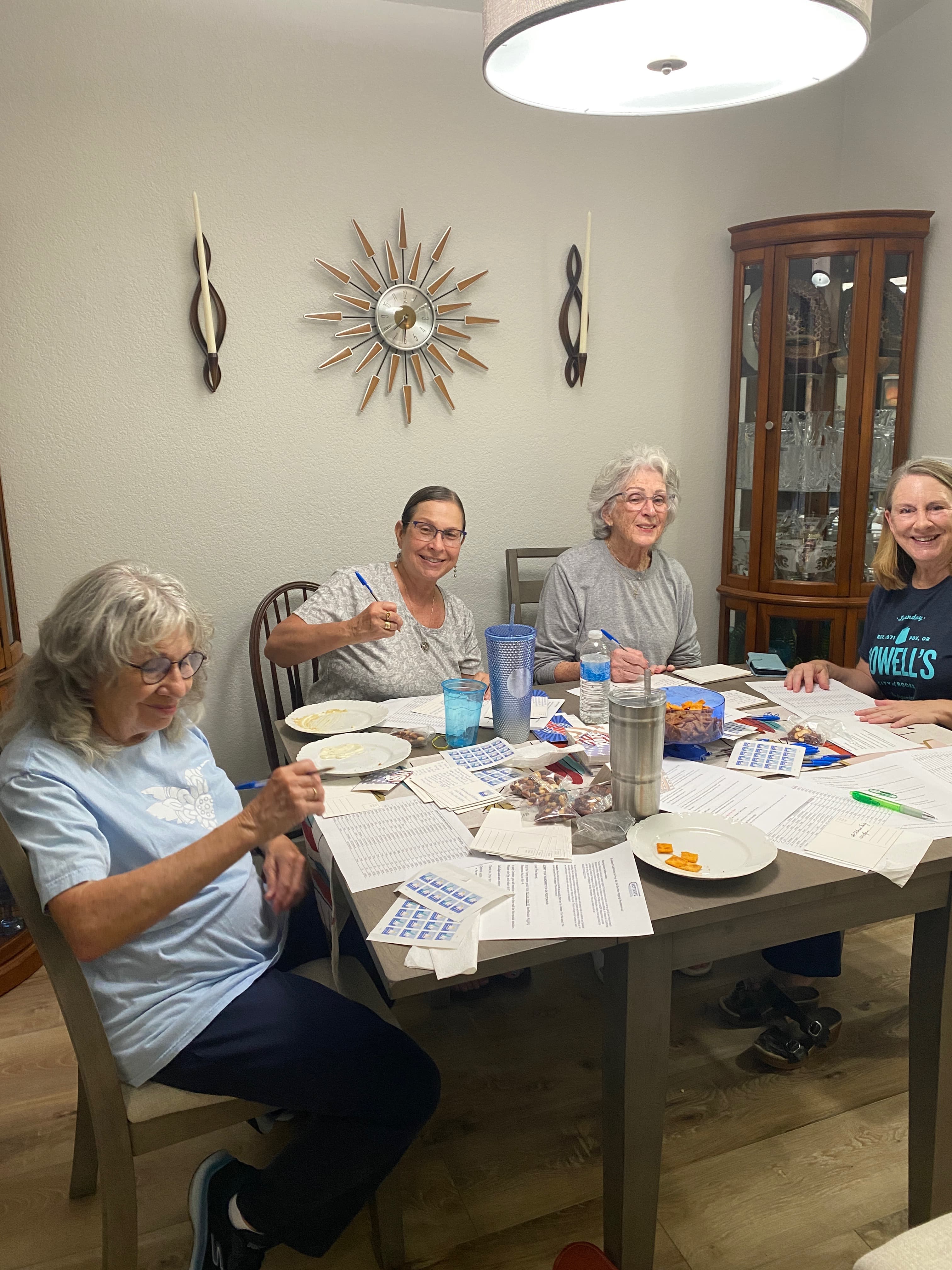 Club volunteers preparing voter outreach postcards in Tracy